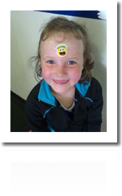 Olivia Jaschke proudly sports her sticker after landing her first AXEL!  Way to Go, Olivia!!